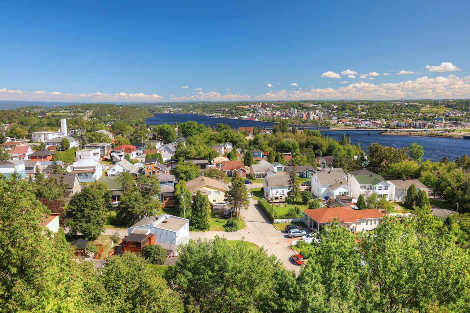 Aerial view during the summer of a residential neighbourhood in the city of Saguenay near the river with the same name.