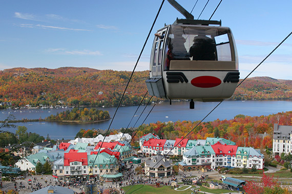 A cable car overlooking the station and Lac Tremblant in the fall.