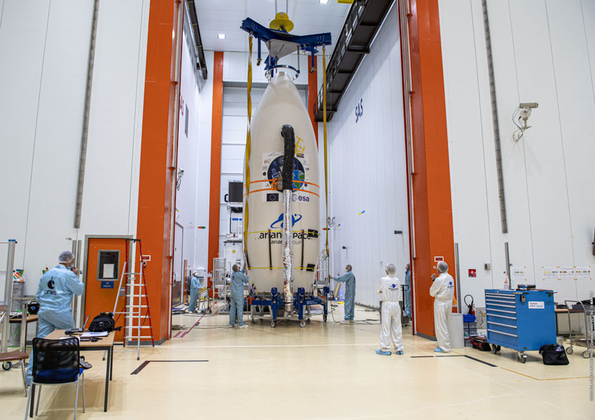 A GHGSat satellite attached to a rocket in a hangar